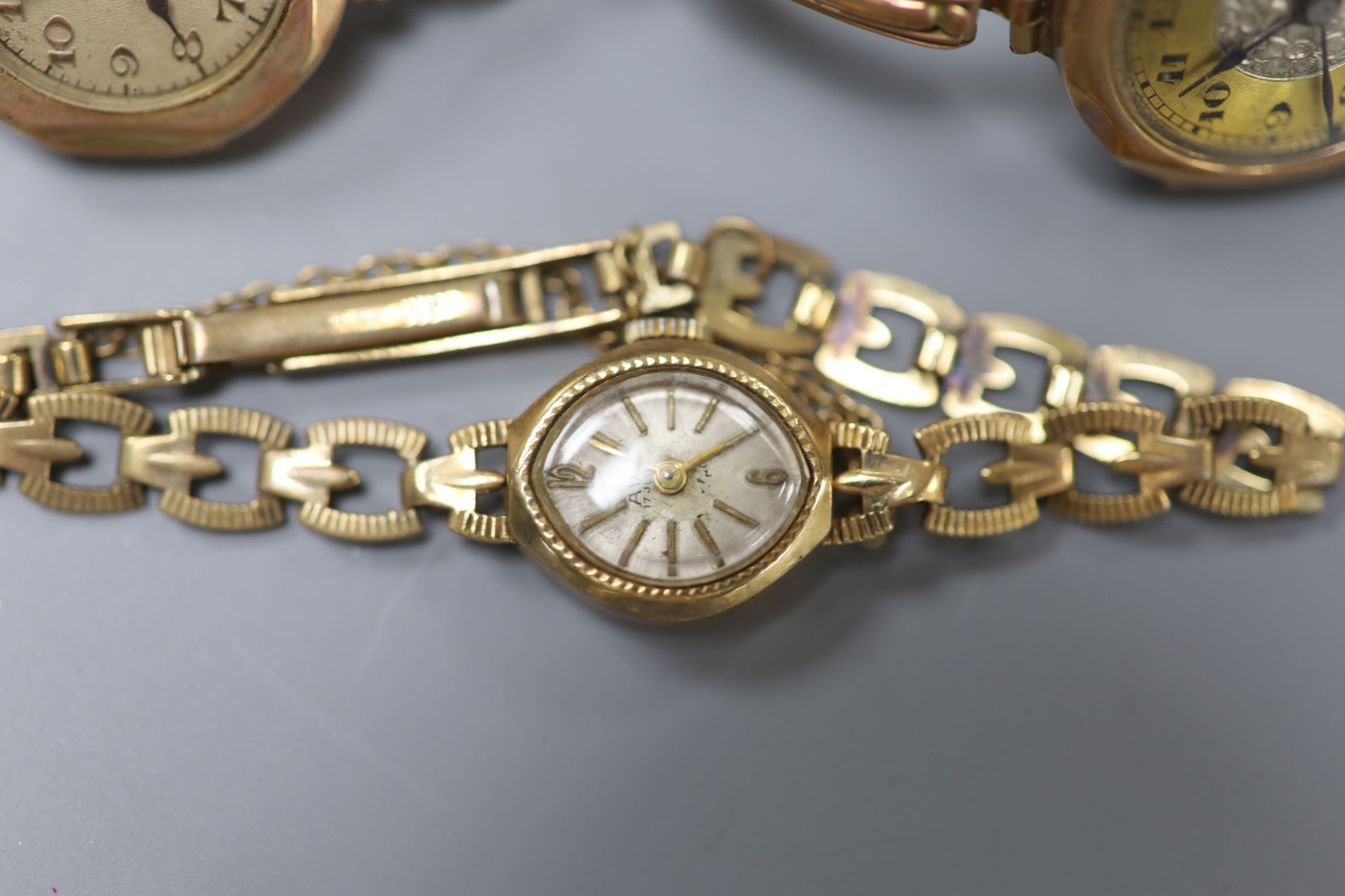 Three 9ct gold-cased ladys wristwatches, one with 9ct gold marked bracelet (latter gross 11.5 grams).